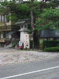 Stone lantern on modern building near the castle